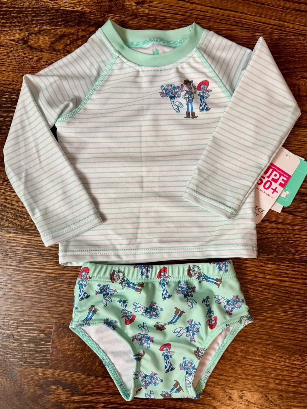 Disney Baby Green and White Striped Swimsuit with Toy Story Characters- 12 Month